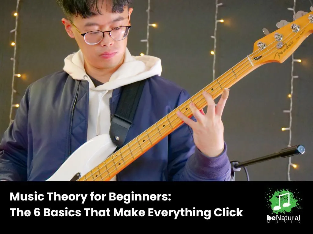Beginner musician playing bass guitar while learning music theory, with overlay text 'Music Theory for Beginners: The 6 Basics That Make Everything Click' – beNatural Music